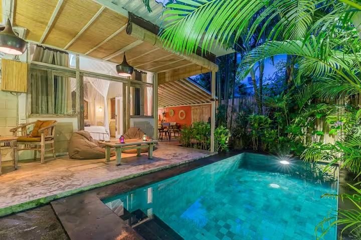 Villa Dua De Is Seminyak, Bali — pool beside covered lounge