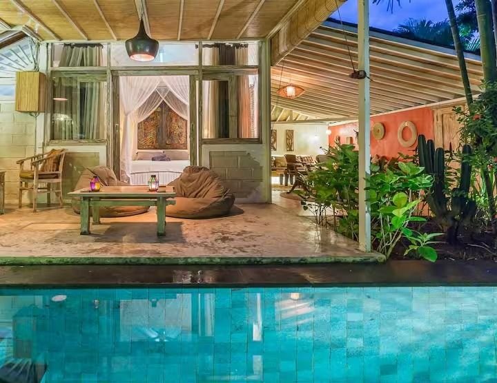 Villa Dua De Is Seminyak, Bali — swimming pool beneath a veranda