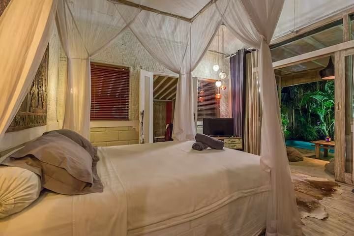 Villa Dua De Is Seminyak, Bali — bedroom and mosquito net