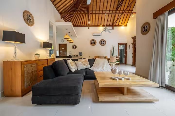 Villa Nemia Seminyak, Bali — living room sofa and timber ceiling