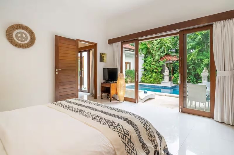 Villa Nemia Seminyak, Bali — bedroom with glass doors