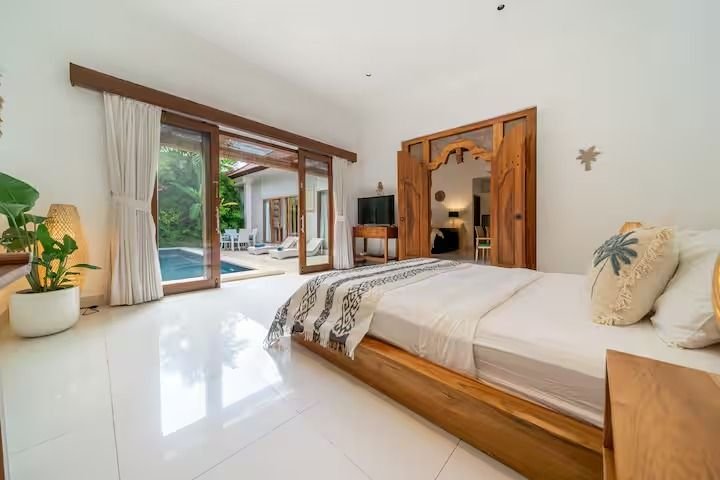 Villa Nemia Seminyak, Bali — bedroom and garden-facing doors