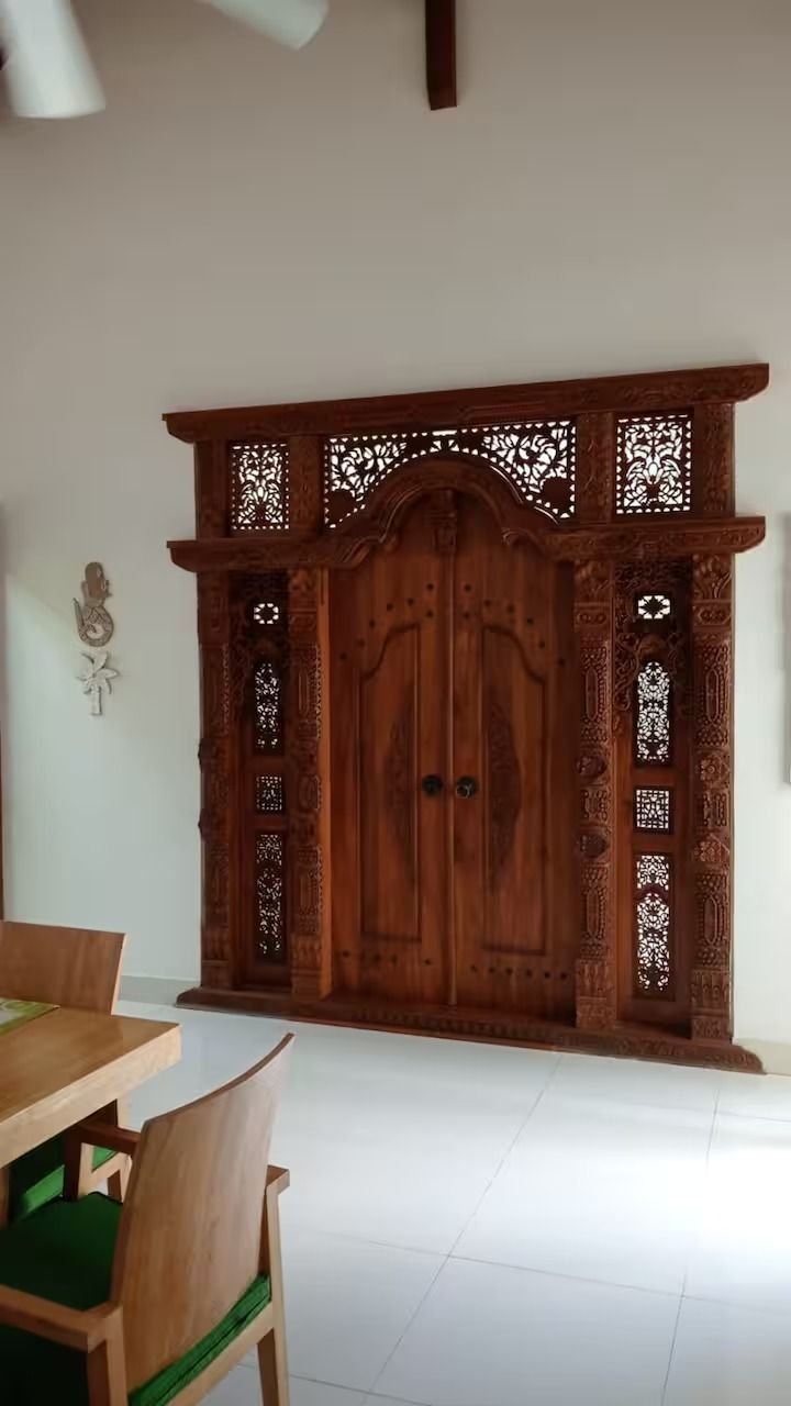 Villa Nemia Seminyak, Bali — carved wooden entrance door
