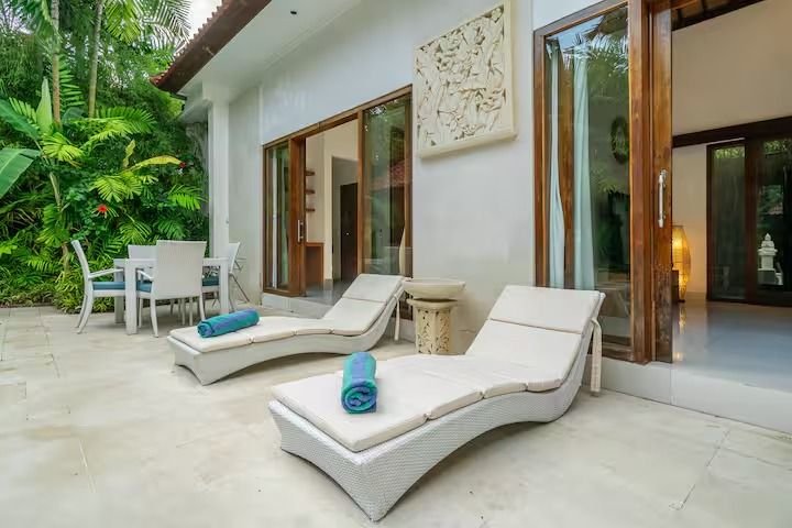 Villa Nemia Seminyak, Bali — sun loungers near a doorway