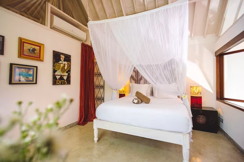 Villa Vickary Seminyak, Bali — bedroom with canopy bed